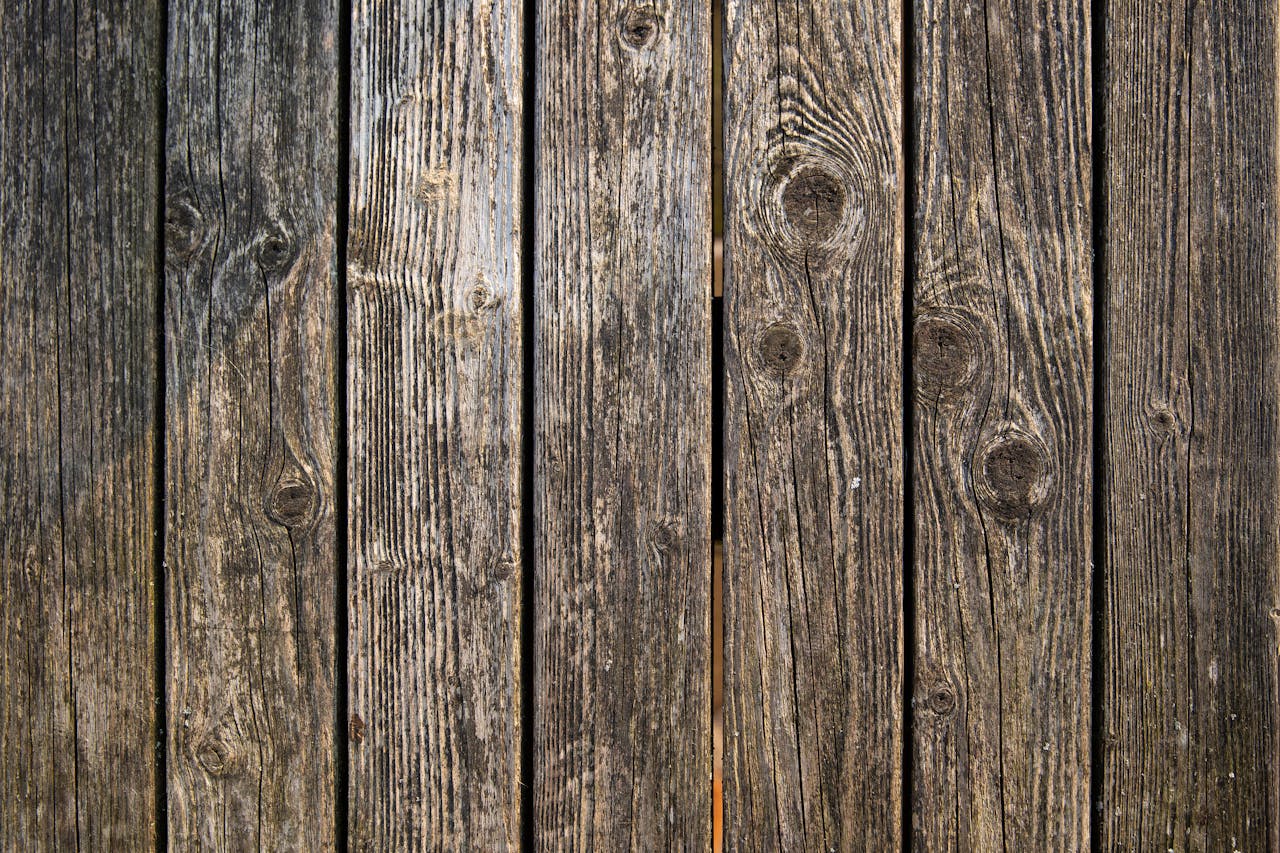 Close-up of weathered wooden planks showcasing unique texture and grain patterns.